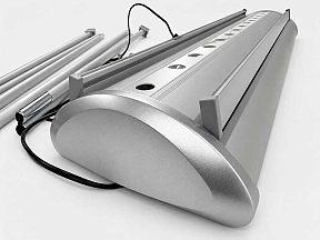 TwinGlow illuminated roller banner cassette with integrated LED lighting system and premium silver aluminium base for exhibition displays