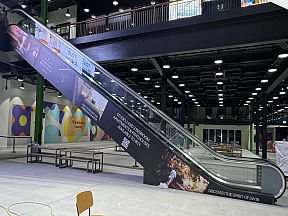 Custom printed removable vinyl applied to escalators in a shopping centre